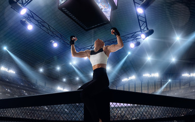 Fototapeta na wymiar MMA female fighters on professional ring.