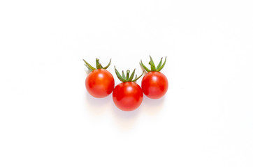 Cherry tomatoes isolated on a white background. Close-up.