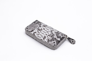 Fashion luxury snakeskin python wallet isolated on a white background.