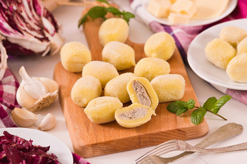 Potato gnocchi stuffed with radicchio and ricotta.