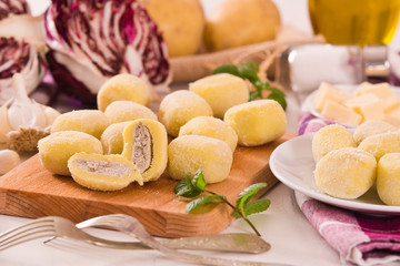 Potato gnocchi stuffed with radicchio and ricotta.