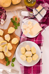 Potato gnocchi stuffed with radicchio and ricotta.