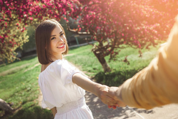 Young family walking together. Pretty couple outdoor. happy people in the park.