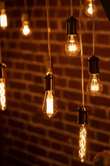 Burning an incandescent edison lamp with a large decorative spiral