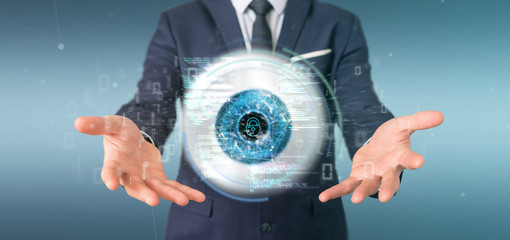 Businessman holding a visual recognition eye concept with data - 3d rendering