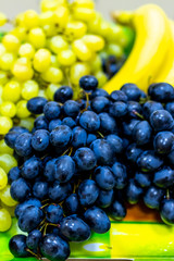 Dish with grape, lifestyle shot.