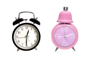 Vintage black and pink alarm clock on a white background