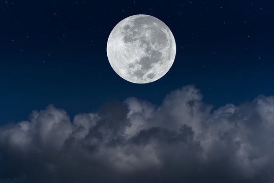 Full moon with blurred cloud on the sky.