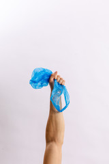 Hands hold trash on a light background. The concept of separate trash, stop plastic, recycling
