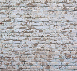 the brick is old painted and the paint