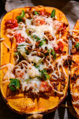 Baked stuffed pumpkin with peppers vegan minced meat and vegan cheese