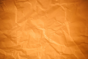Brown crumpled paper background.