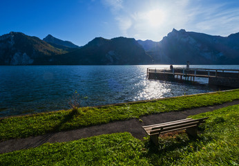 Peaceful autumn Alps mountain lake. Morning view to Traunsee lake and Traunstein mountain in far, Upper Austria.