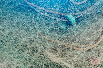Abstract background of mesh of fishing net with light beam. Close up view with selective focus