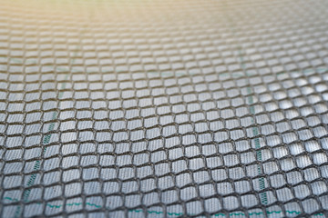 Fototapeta premium Close up view of fishing net in marine port in the morning. Selective focus. Blurred pattern background