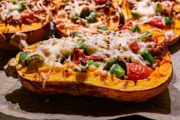 Baked stuffed pumpkin with peppers vegan minced meat and vegan cheese