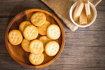 Dessert biscuit and cracker sweet food in coffee time put on the wood plate and wood table 