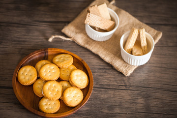 Dessert biscuit and cracker sweet food in coffee time put on the wood plate and wood table 