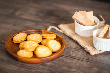 Dessert biscuit and cracker sweet food in coffee time put on the wood plate and wood table 