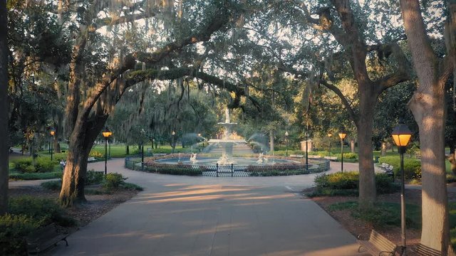 Aerial:  Fountain & oak trees with Spanish Moss. Forsyth Park. Savannah, Georgia, USA.