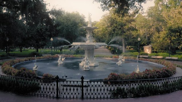 Aerial:  Fountain & oak trees with Spanish Moss. Forsyth Park. Savannah, Georgia, USA.