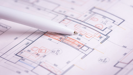 Repair plan on paper close-up. Details on a paper plan. Paper drawing of a plan. A ballpoint pen indicates details on a plan. 