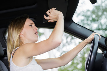 angry woman driver with road rage yelling at someone