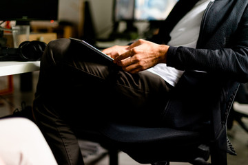 Male hands holding digital tablet