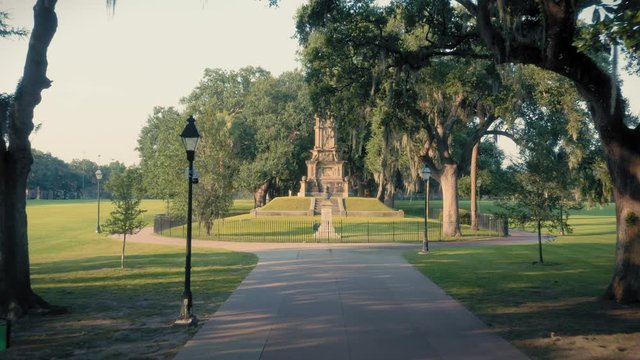 Aerial: Fountain & Spanish moss on oak trees and monument. Forsyth Park,  Savannah, Georgia, USA. 8 August 2019