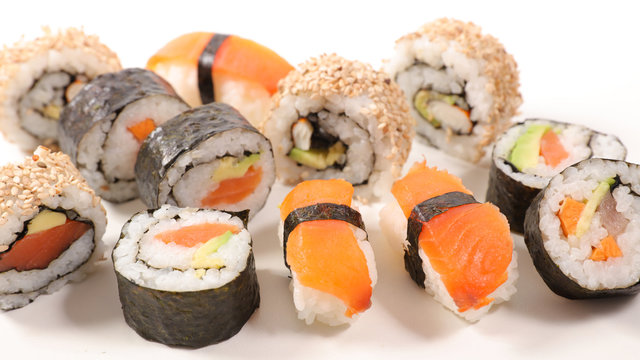 assorted of maki, sushi and rolls with salmon, shrimp and avocado- japanese sushi food
