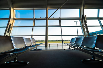 Airport terminal. Contemporary lounge with seats in the airport.