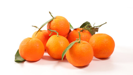 clementine and leaf on white background