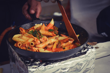 Cooking pasta in kitchen
