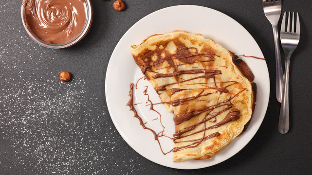 Crepe With Chocolate Sauce In Plate