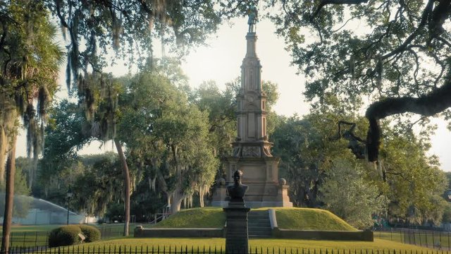 Aerial: Monument & Spanish moss on oak trees. Forsyth Park,  Savannah, Georgia, USA. 8 August 2019