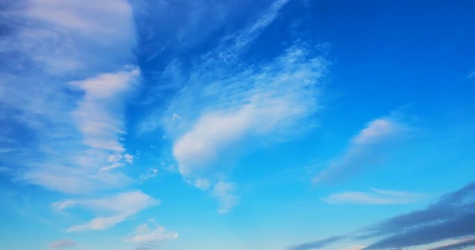 cirrus clouds flying against a blue sky