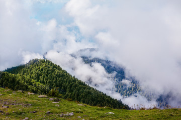 Fototapeta premium Mountain peaks above the clouds in Abkhazia