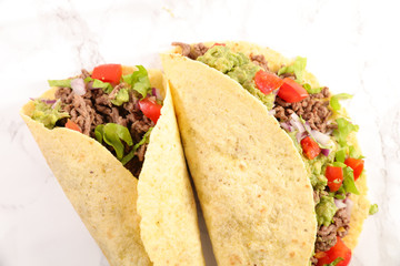 tacos with guacamole, beef, tomato and cheese- tortilla bread