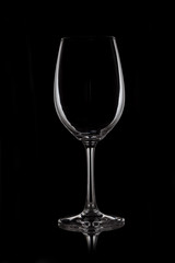 Glass wine glass stands on glass on black background