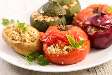 baked vegetable- tomato, zucchini and potato stuffed with cereal