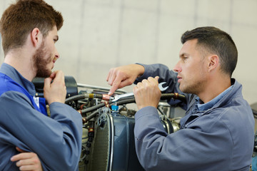 experienced auto mechanic in repair shop