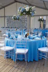 cutlery on a blue tablecloth in a restaurant