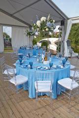 cutlery on a blue tablecloth in a restaurant