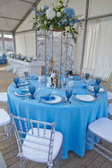 cutlery on a blue tablecloth in a restaurant