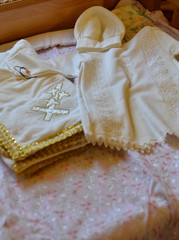 Clothing for the child for the rite of Catholic and Orthodox baptism. Light dress and hat, kryzhma for the sacrament of baptism.