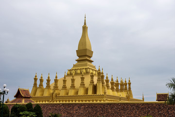 Fototapeta na wymiar The golden Pagoda at Wat Pha That Luang Temple in Vientiane, Laos