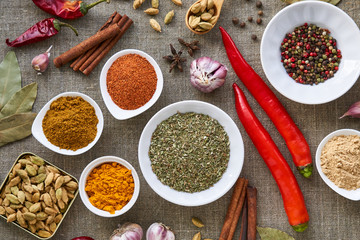 Various spices and seasonings on a fabric background