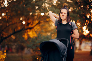 Woman Stretching in the Park Next to a Baby Stroller