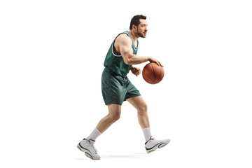 Fototapeta na wymiar Basketball player running with a ball