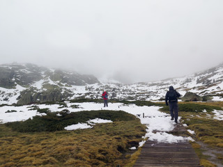 men climbing in the snow